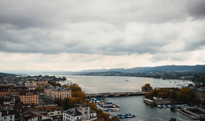 Admire the View of the Lake and the Alps